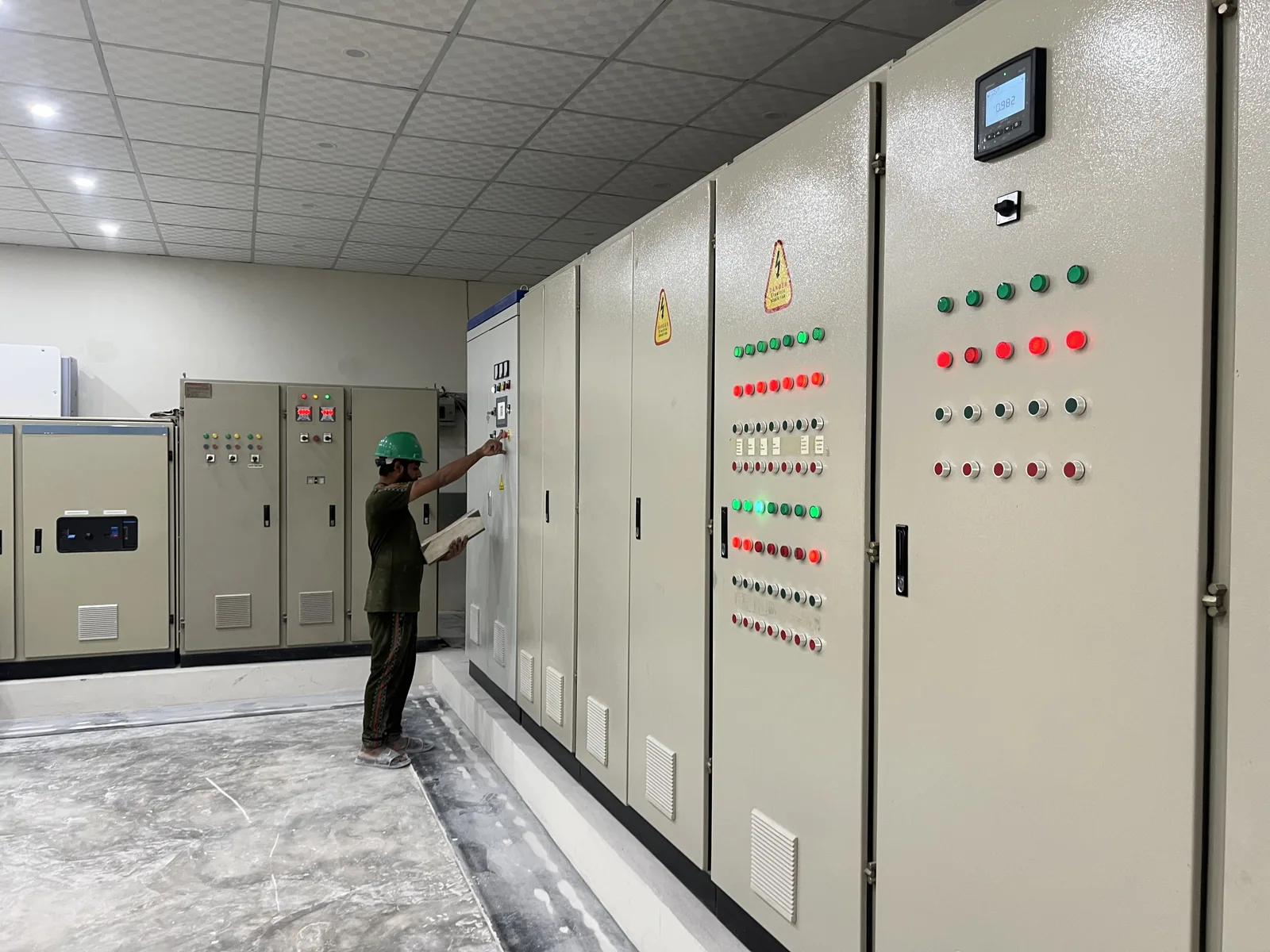 Operator monitoring process control equipment at Asian Carbonate